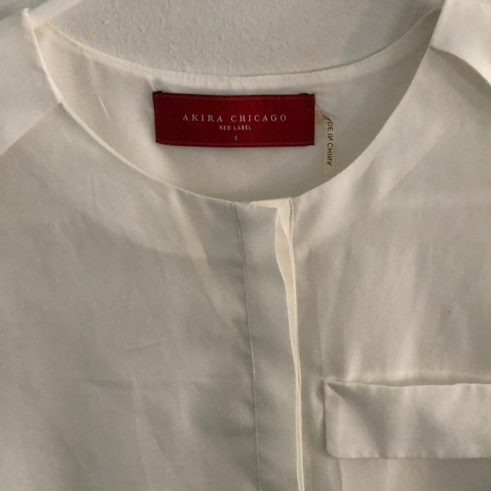 Semi sheer white polyester blouse by Akira Chicago